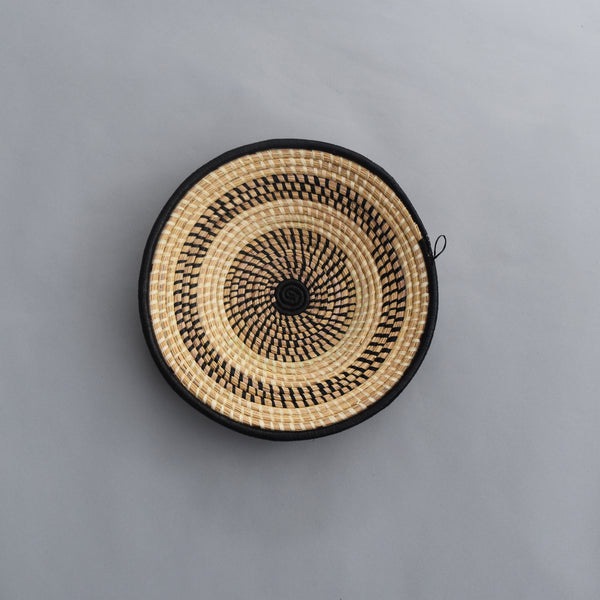 Hand woven straw. A tradition and art which has been part of Ugandan culture for centuries.  With all of the materials used being natural products or recycled, we also believe this is a lovely way of making use of natural resources the world has to offer and making positive changes to become more sustainable.  Beautifully, unique, handmade basket made out of banana stalks and raffia fibres also known as the Ugandan basket.
