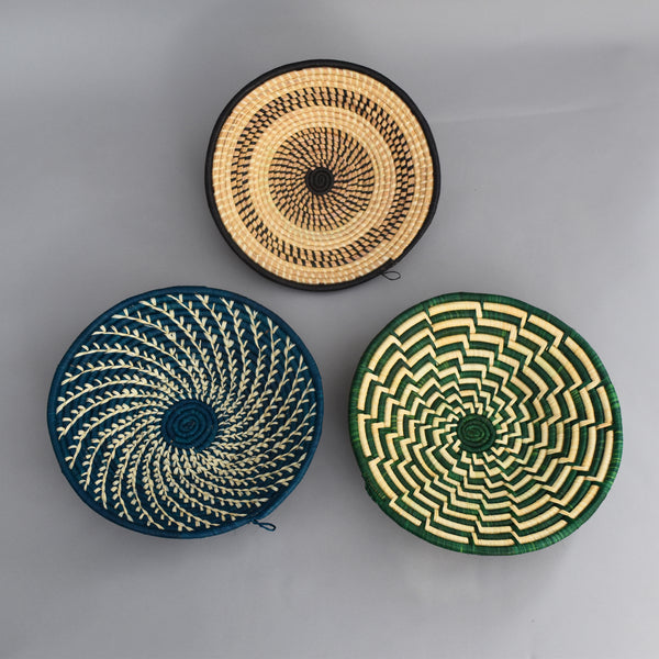 Hand woven straw. A tradition and art which has been part of Ugandan culture for centuries.  With all of the materials used being natural products or recycled, we also believe this is a lovely way of making use of natural resources the world has to offer and making positive changes to become more sustainable.  Beautifully, unique, handmade basket made out of banana stalks and raffia fibres also known as the Ugandan basket.