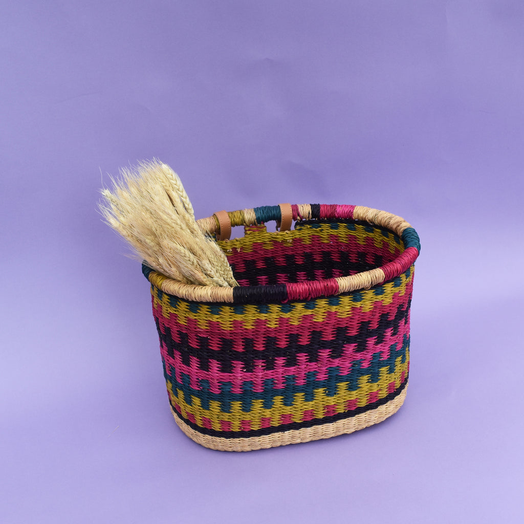 The perfect fair-trade accessory you need for your bike to help carry items freely, be it a little shopping or bits and bubs. It comes with a faux leather strap so that it can be fitted on the bike. It’s colorful, stylish and most importantly eco-friendly and It doesn’t matter if it gets wet. All you need to do is dry it in airy place. It is easy to strap and unstrap onto the bike as and when needed.  The basket is made of Elephant grass in Bogla, Ghana. It is environmentally friendly, 100% degradable, and