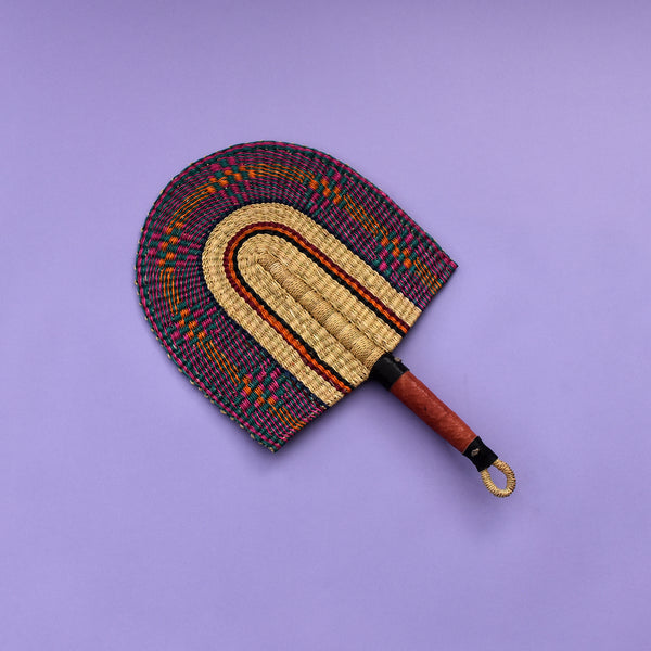 Durable handcrafted fans also known as Bolga fans, are woven from elephant grass and leather and dyed to give them a unique design or patterns. Each hand fan is a one-off piece so once it’s gone it’s gone.   The fans are perfect for keeping cool in the heat and for decorative purposes.   The handle has a loop at the end of the fan which makes it easy for hanging. You can equally mix and match a number of fans together as a piece of art display on the wall. You can also be creative in your own way. 