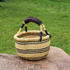 Small Round Straw basket I African Basket  This African straw basket also called Bolga basket is handwoven from elephant grass and dyed. It makes a great eco-friendly decorative bag, hamper basket, or storage basket.