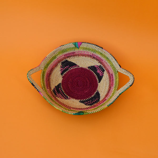  This carefully hand-woven fruit baskets is made of Elephant straw. No basket is the same, each piece has been handcrafted in Bolga, Ghana. There may be some imperfections but that is due to the fact that they are handmade.  Not only is it straw basket or bowl great for storing your fruit and vegetables, It can be used for quiet a number of things including storing bits & bobs and decorating. A stylish way to keep clutter away in the house.  It is 100% eco-friendly and practical and versatile.